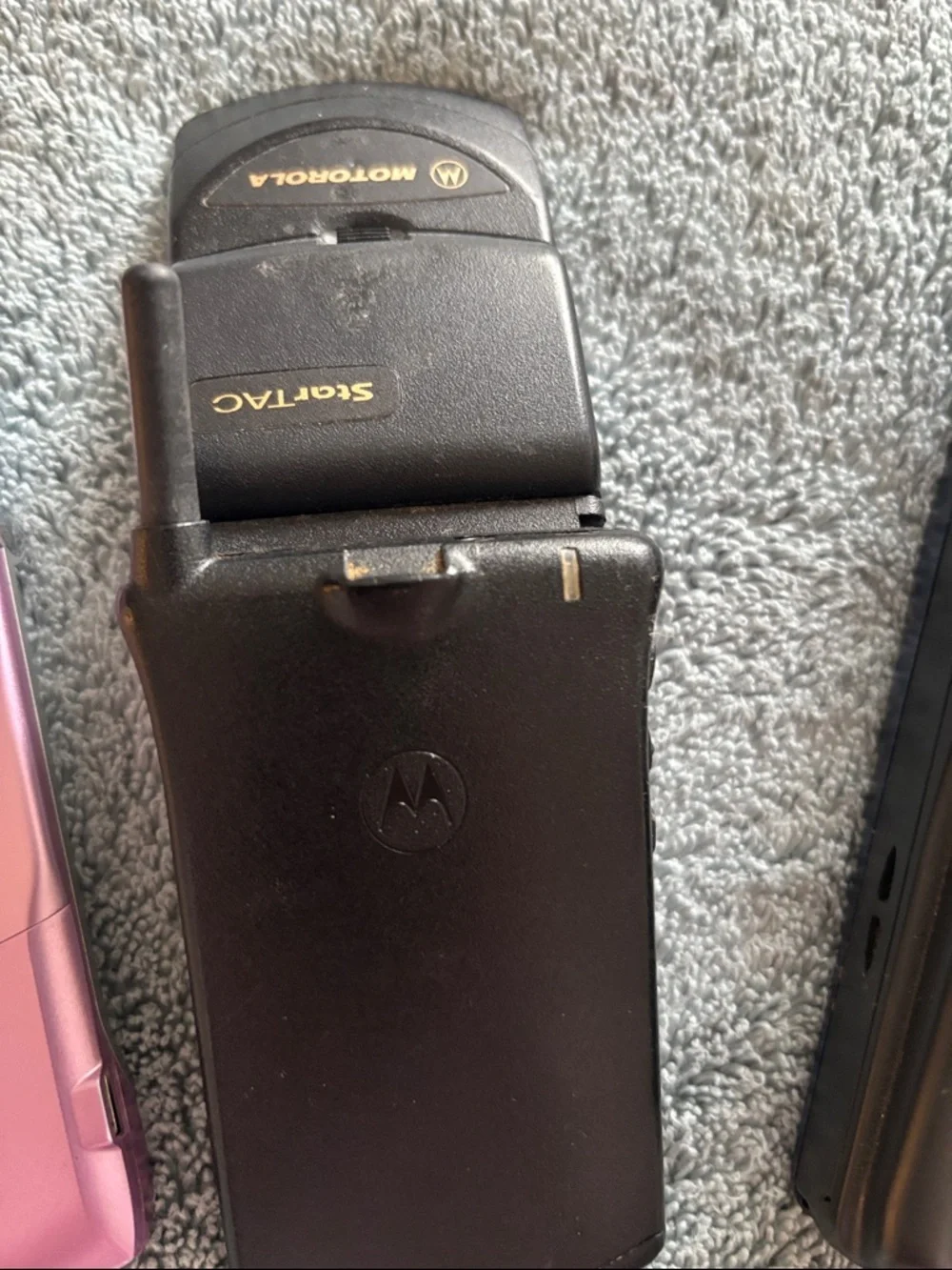 Vintage Collection of cell phones includes StarTAC and Pink Flip